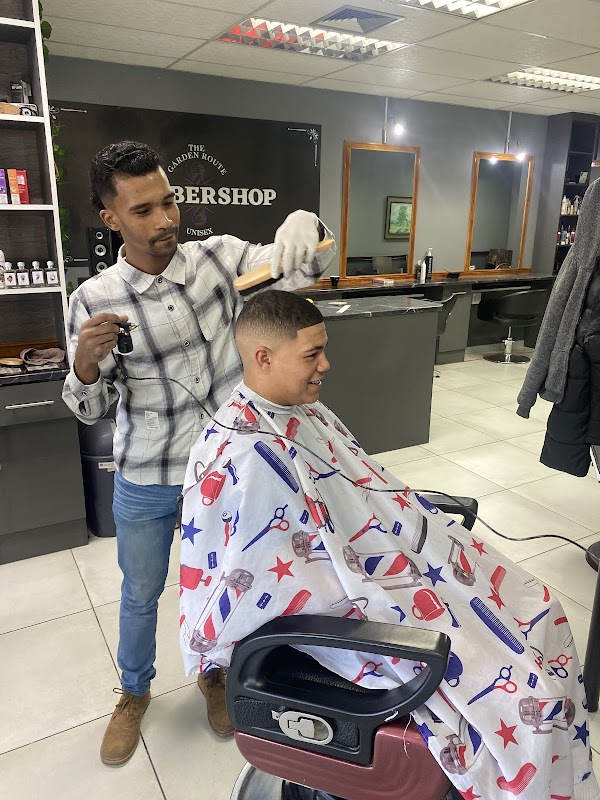 Barber cutting a customer's hair with precision