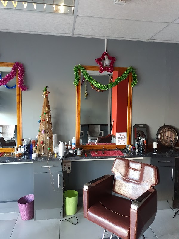 Barber stations with mirrors inside The Garden Route Barber Shop